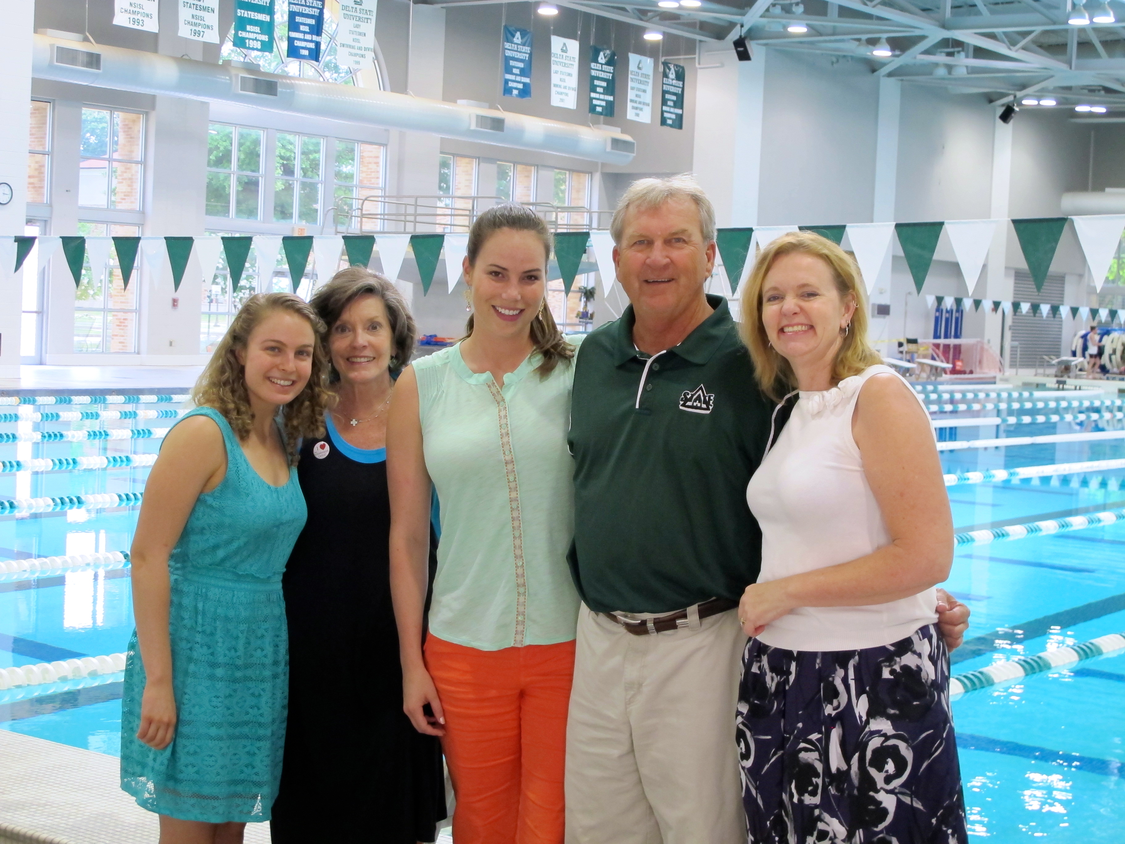 Caption:  Robertson Scholar and 2013 Delta Center intern Rachel Anderson, the Delta Center’s Lee Aylward, Elaine Penrose, Delta State Athletic Director Ronnie Mayers, and Vicki Stocking at the Delta State Aquatics Center.  Elaine Penrose and Vicki Stocking coordinate the Robertson Scholars’ summer programs. 